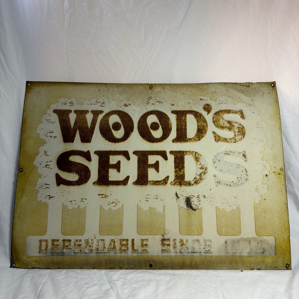 Woods Seeds Embossed Tin Sign