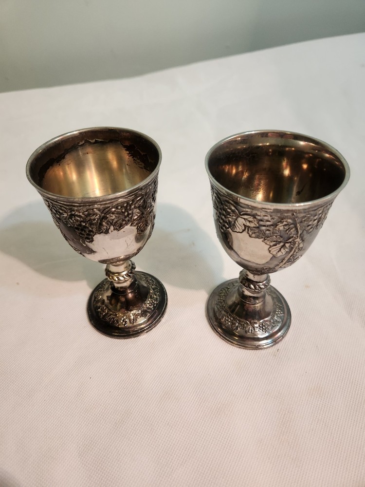 Vintage silverplate goblets featuring a raised grape vine pattern