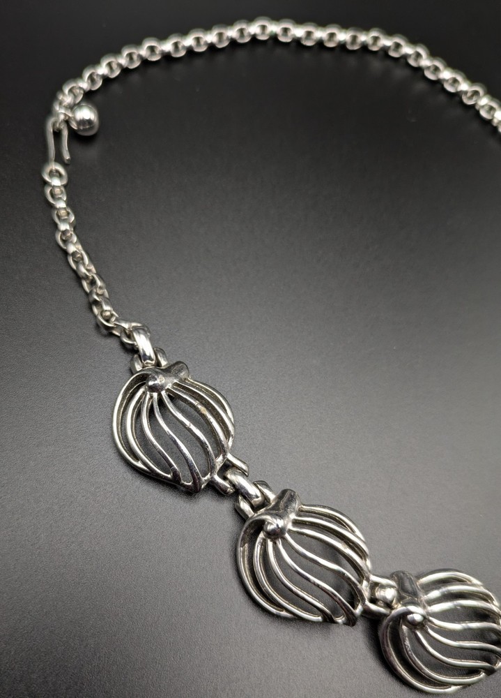 Silver-Toned Bracelet and Necklace Set Featuring Abstract Leaf Patterns