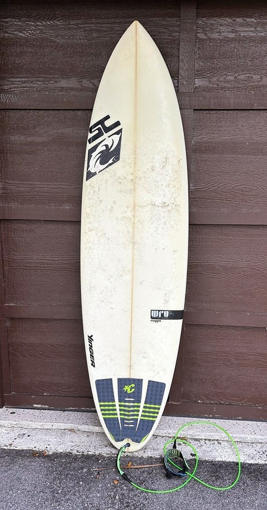 YANCER Surfboard and a cover