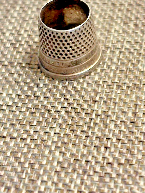 Antique silver thimble, 3/4" high, delicate scroll work and 'sterling' inscribed
