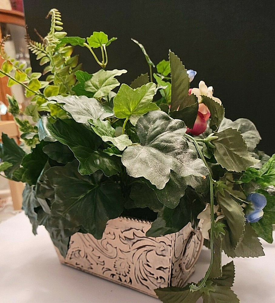 CREAM TIN RECTANGULAR PLANTER WITH HANDLES FILLED WITH FLOWERS