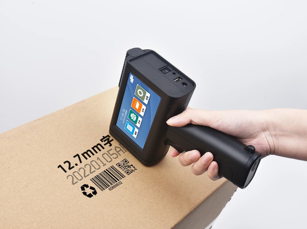 Handheld inkjet printer prints date, logo text, variable data on cardboard box