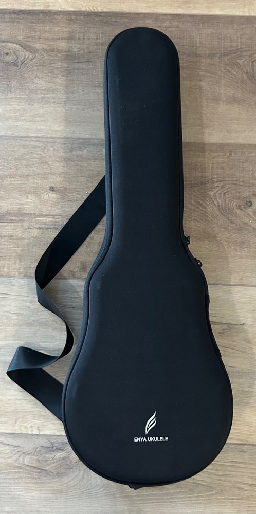 Enya Ukulele White, never used, tuner, extra strings, strap, case, very nice