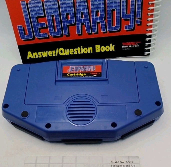 Tiger Electronics Jeopardy Hand Held Game 1995 with Answer Book & Manual