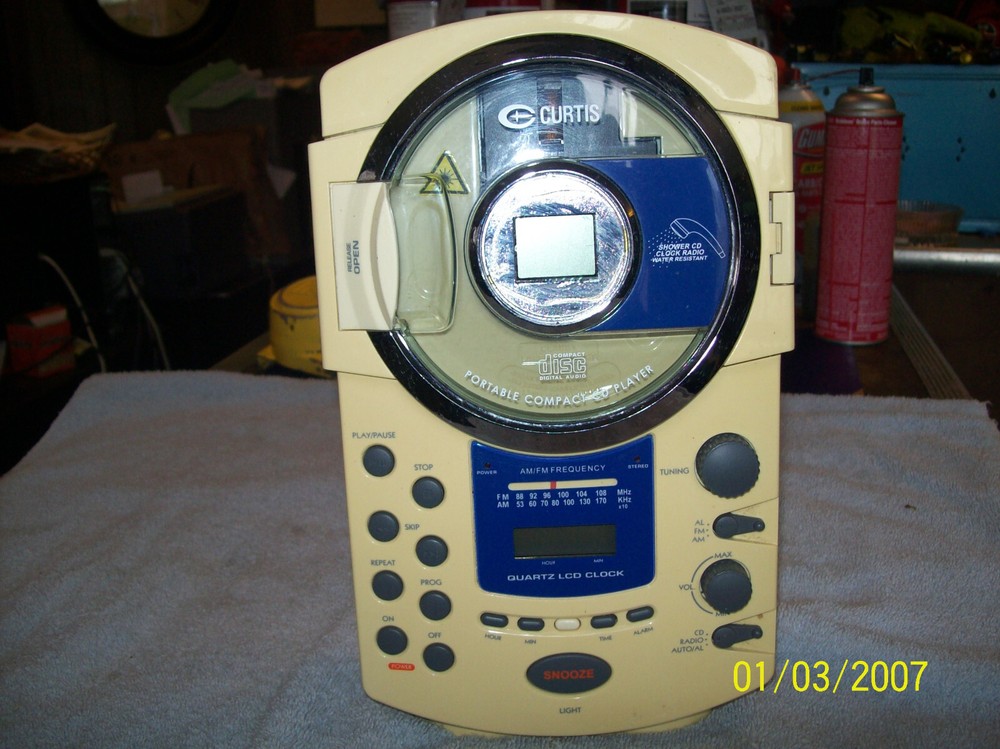 CURTIS MODEL RS57A PORTABLE COMPACT CD PLAYER