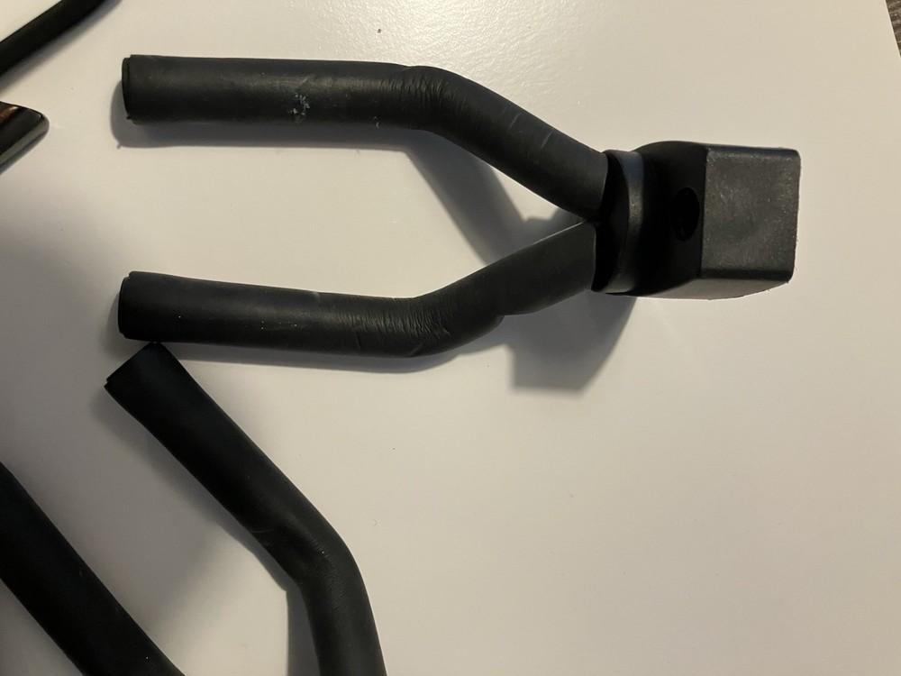 Three guitar wall hangers plus guitar hook