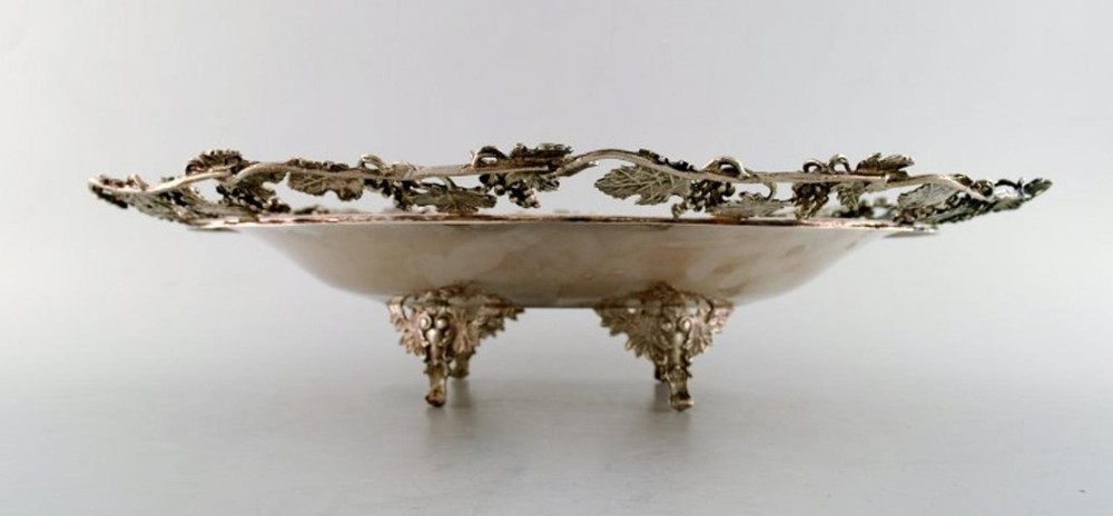 Large silver bowl pierced with grape vines.
