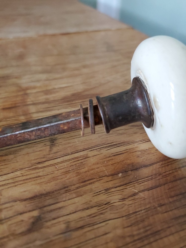 Two Antique Victorian White Porcelain Door Knobs With Iron Stem