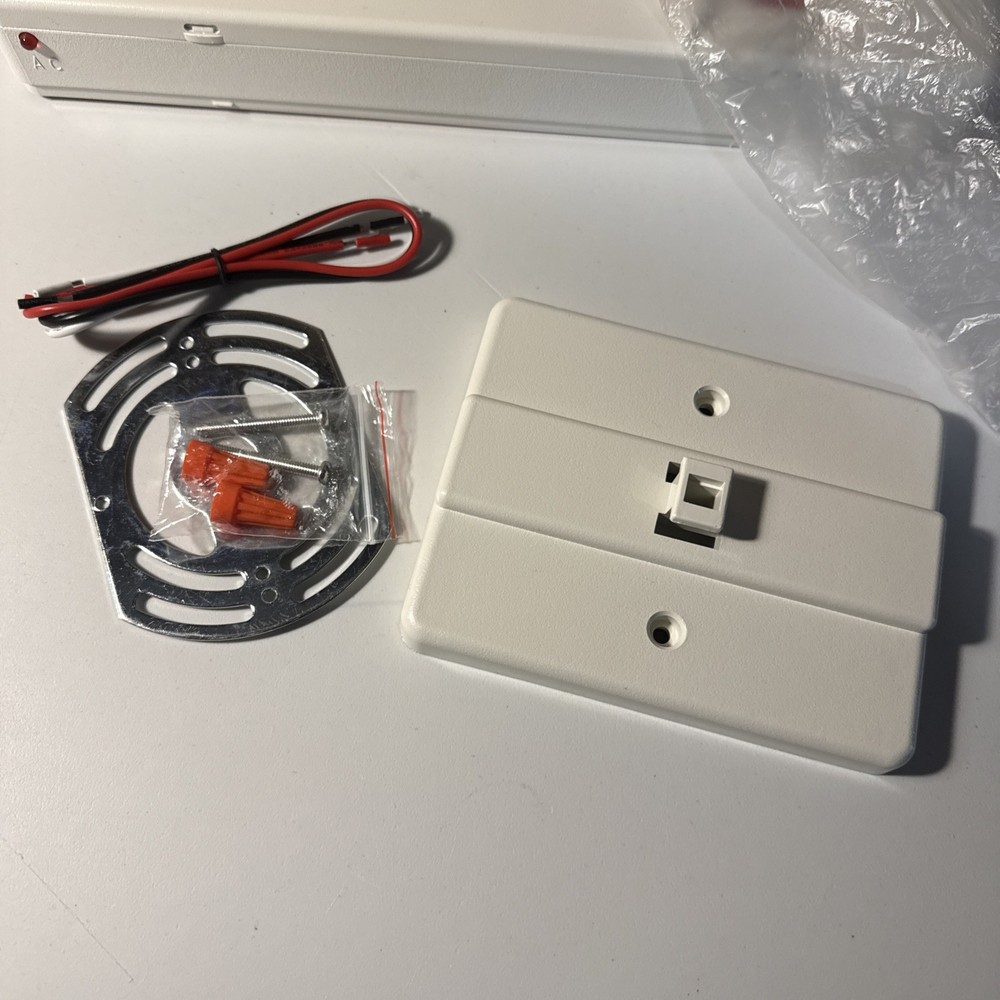 Red Light White Housing Battery Back Up Exit Sign.