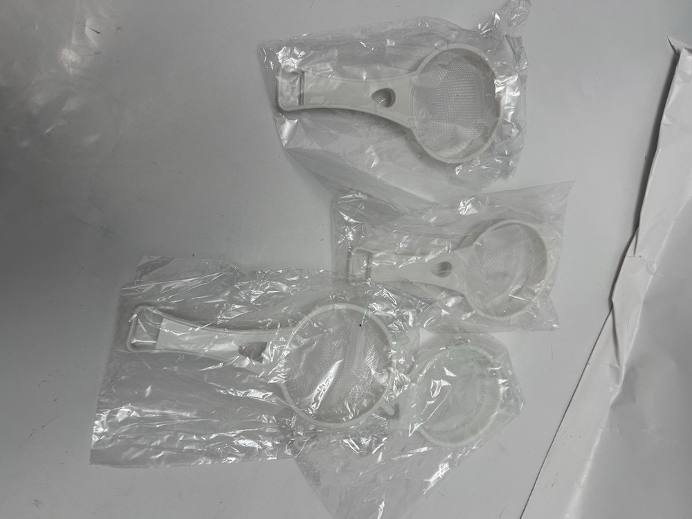 4 unopened 3" circular handheld sifters, small