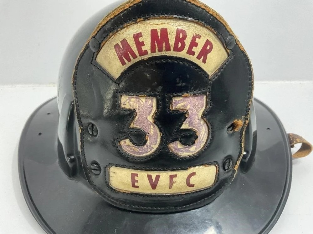 Black Firefighter Helmet front shield marked 'MEMBER 33 EVFC.