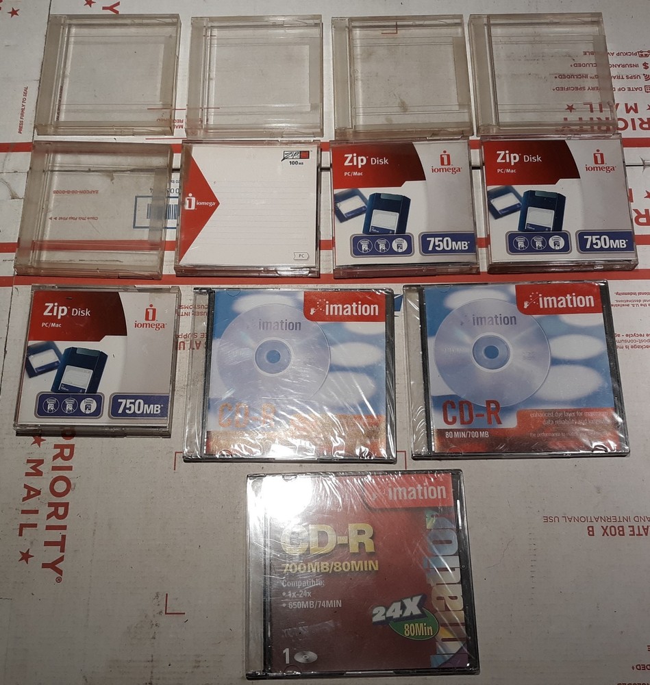 12 pc. Lot New Zip Discs, Empty Jewel Cases & CD Discs.