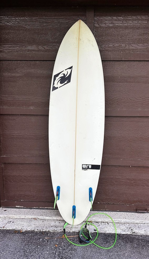 YANCER Surfboard and a cover