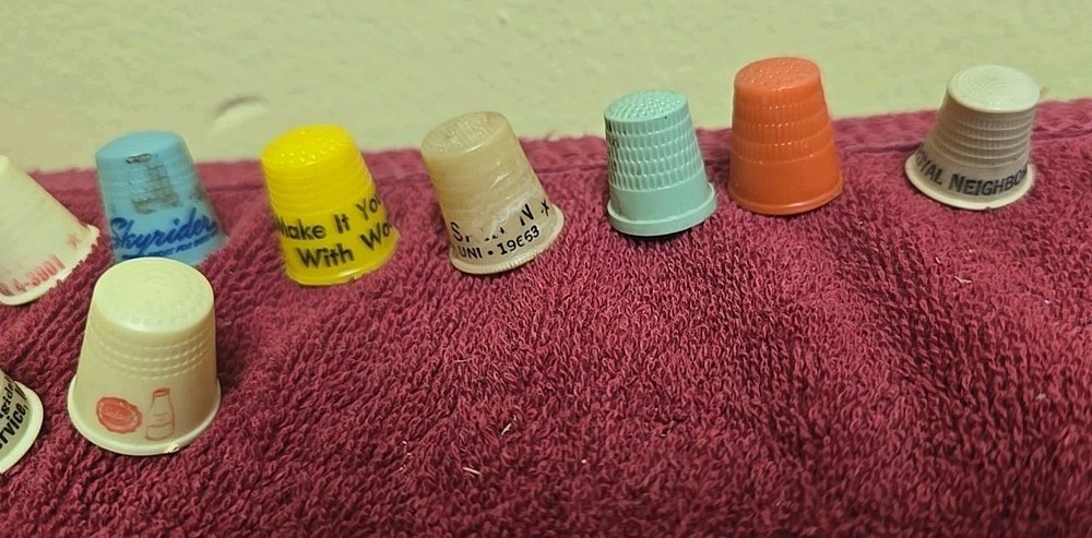 17 Plastic Thimbles 15 Have Advertising On Them