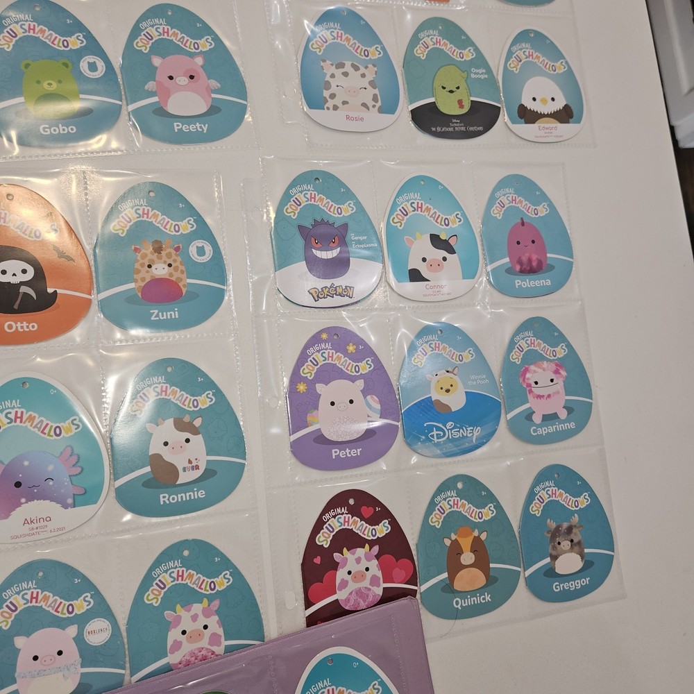 71 Squishmellow Tags In Binder. TAGS ONLY
