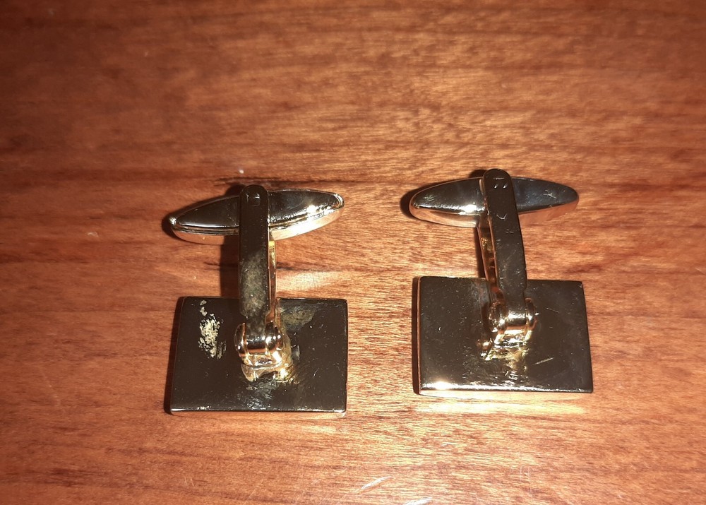 Cufflinks with black pattern in square shape