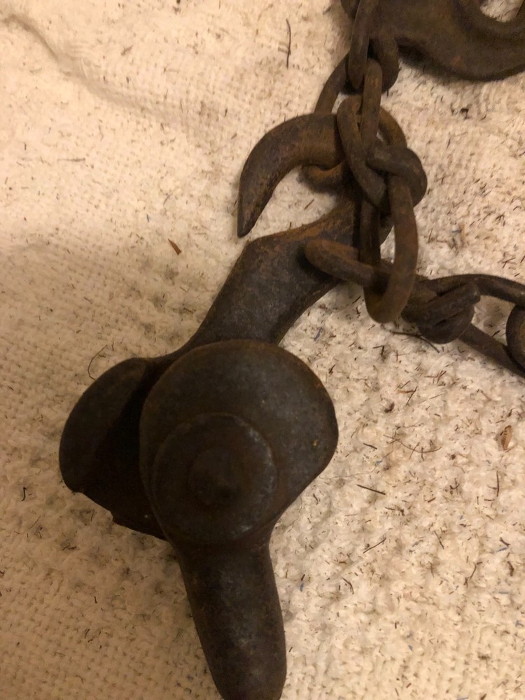 Antique primitive rope and chain hoist