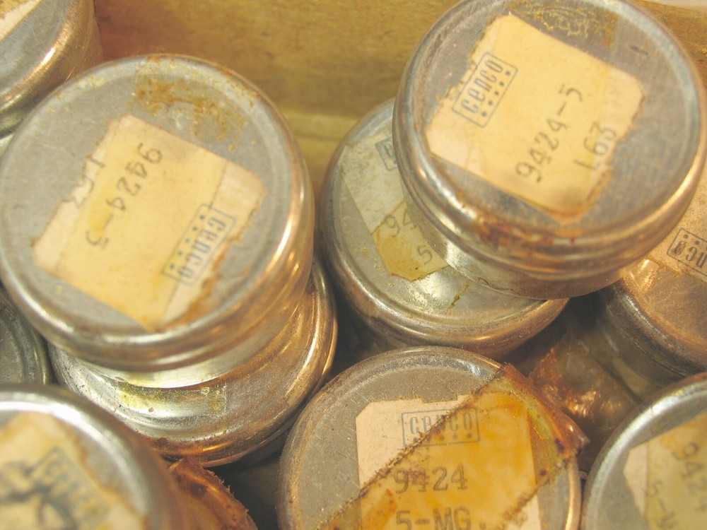 Collection of tiny marked weights 5mg-500mg.