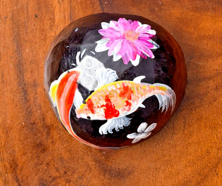Coconut shells hand painted with different faces specified for hotel decorations