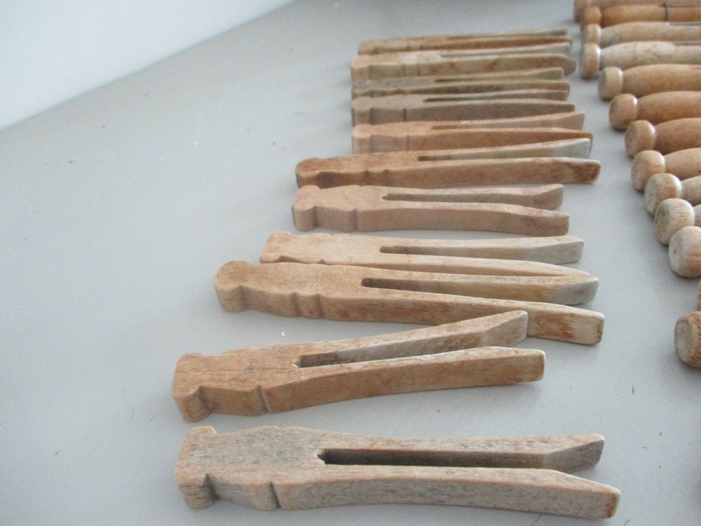 Antique Primitive wood clothes pins. Knobs on top.Two different styles. 46 total