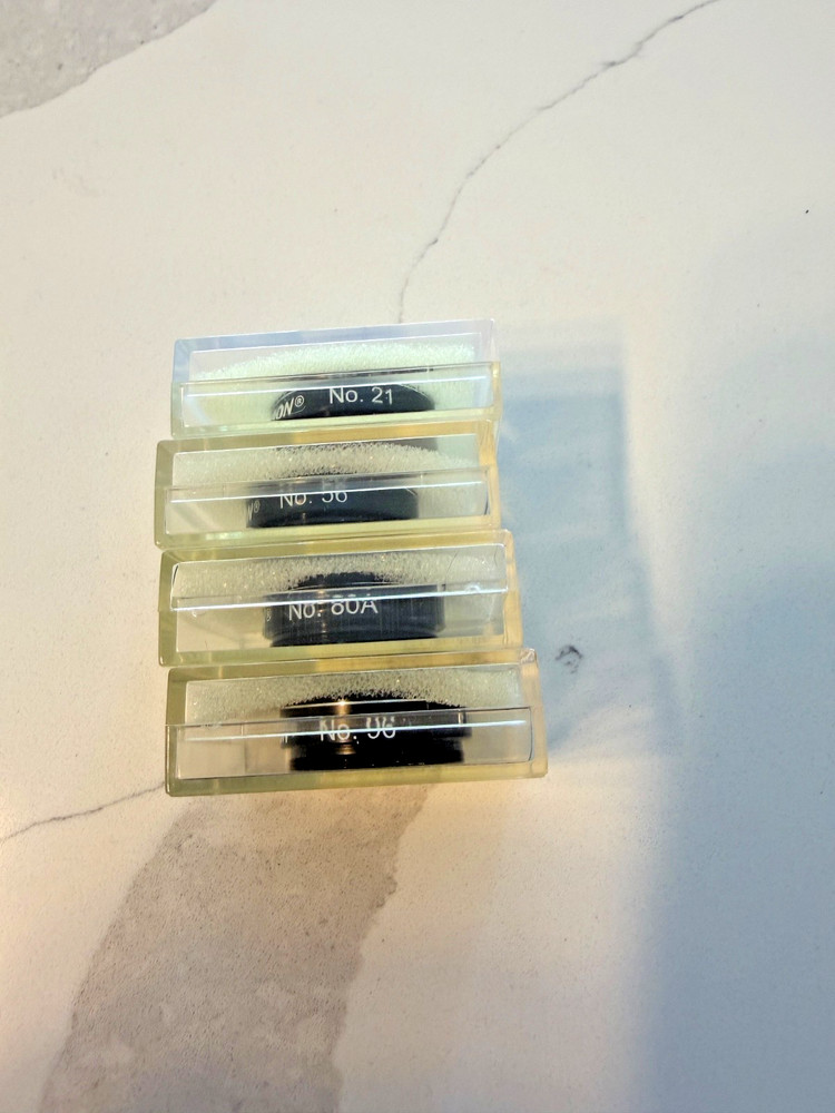 Four Celestron 1.25" filters, 21, 56, 80a, 96, GUC