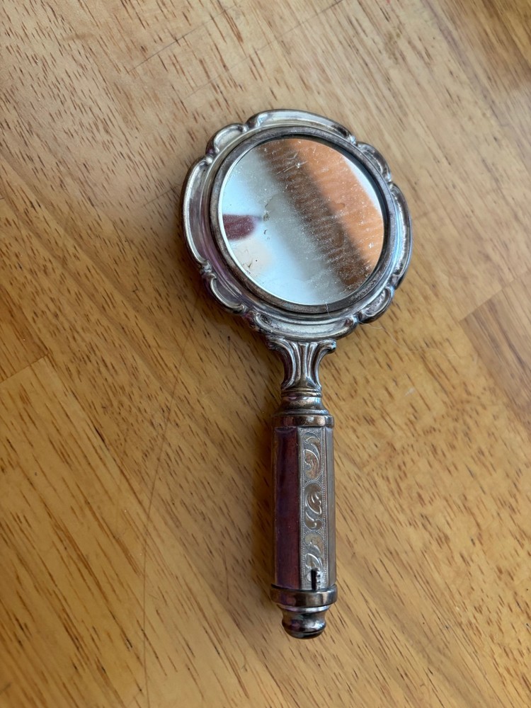 silver hand held mirror compact