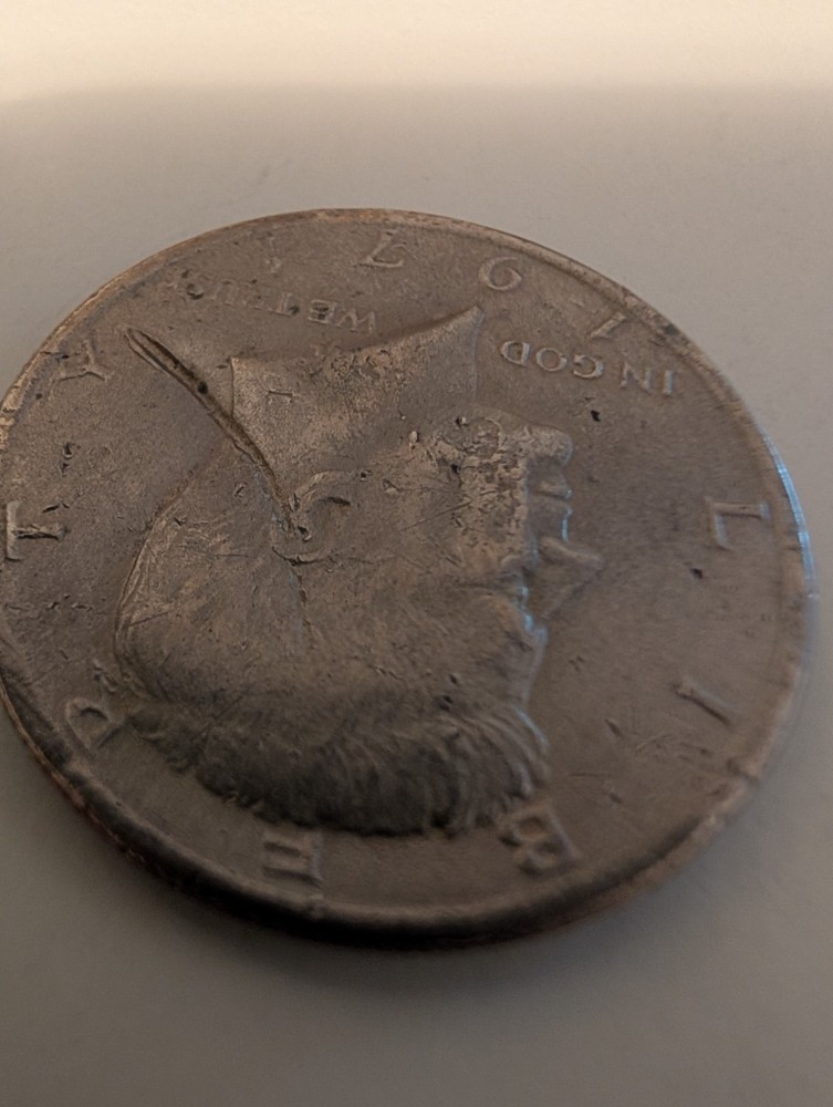 1971 Half Dollar Struck Through Wire And Error On His Cheek