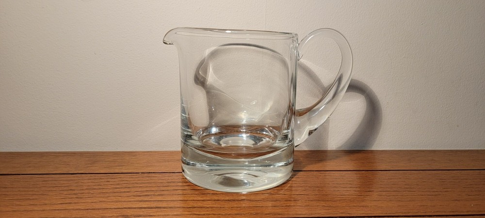 VINTAGE HAND BLOWN GLASS PITCHER WITH APPLIED HANDLE.