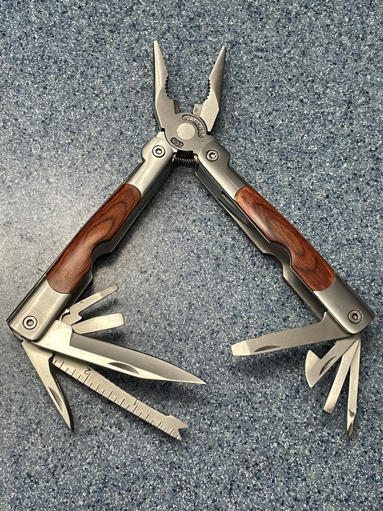 Elk Ridge-Multi Tool With Assorted Tools -pliers -knife-sockets- Bottle Opener