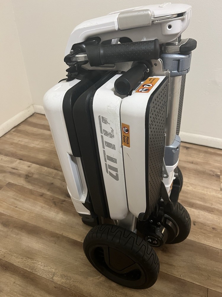 Atto folding scooter color black and white three wheels solid tires