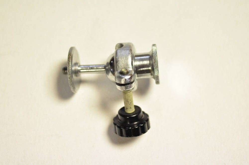 2 1/4" tall ballhead with 1/4" thread at both ends. Well made.