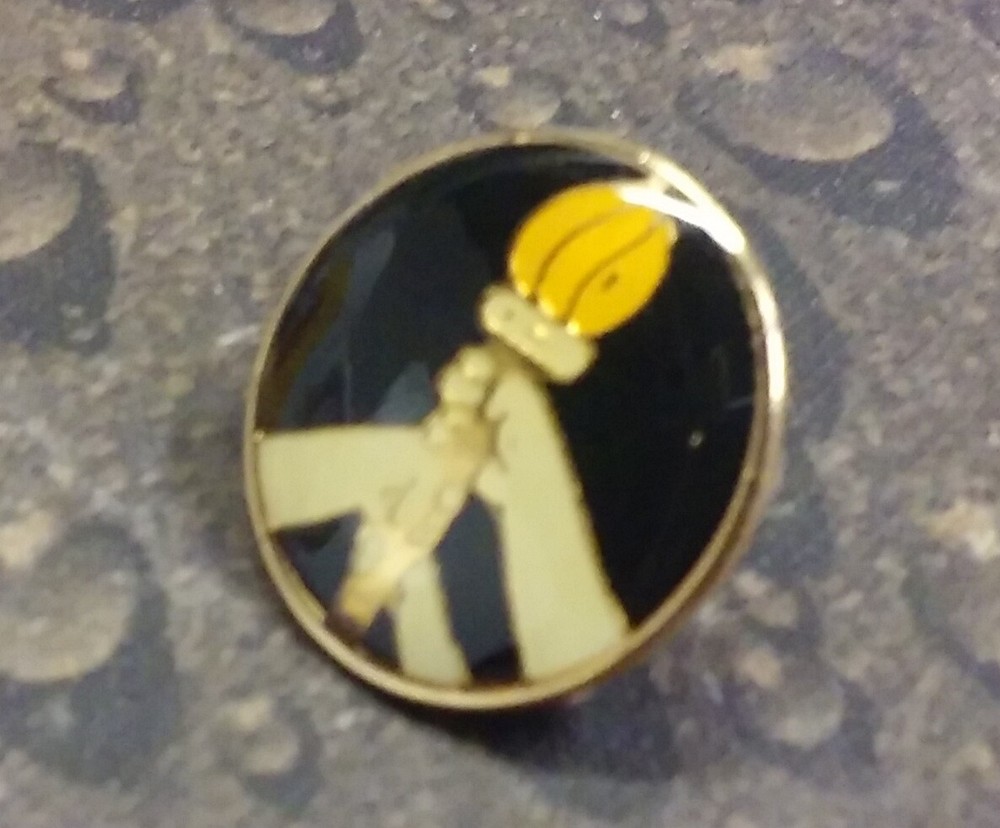 Carrying the Torch pin badge