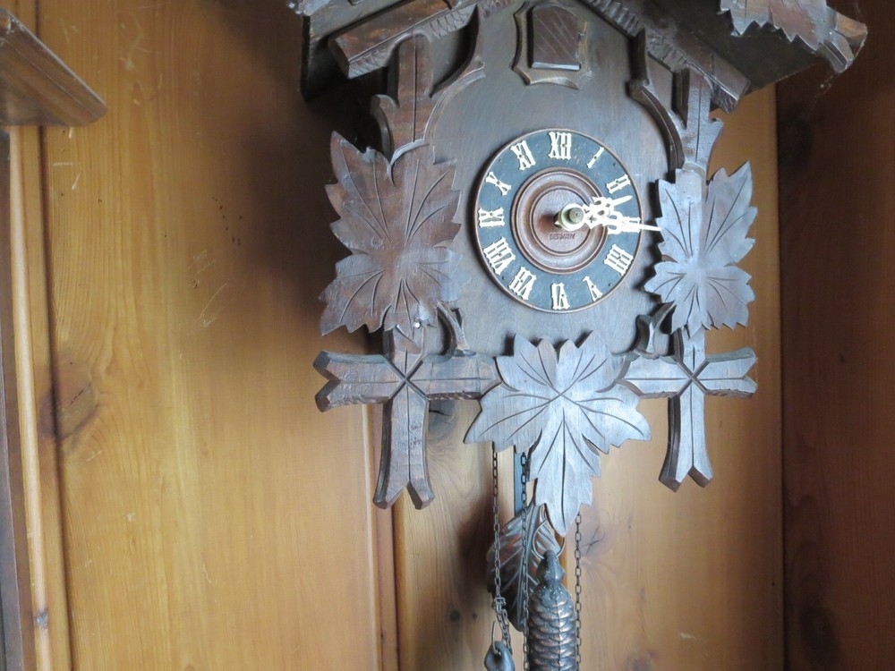 Old Cuckoo clock with articulated bird