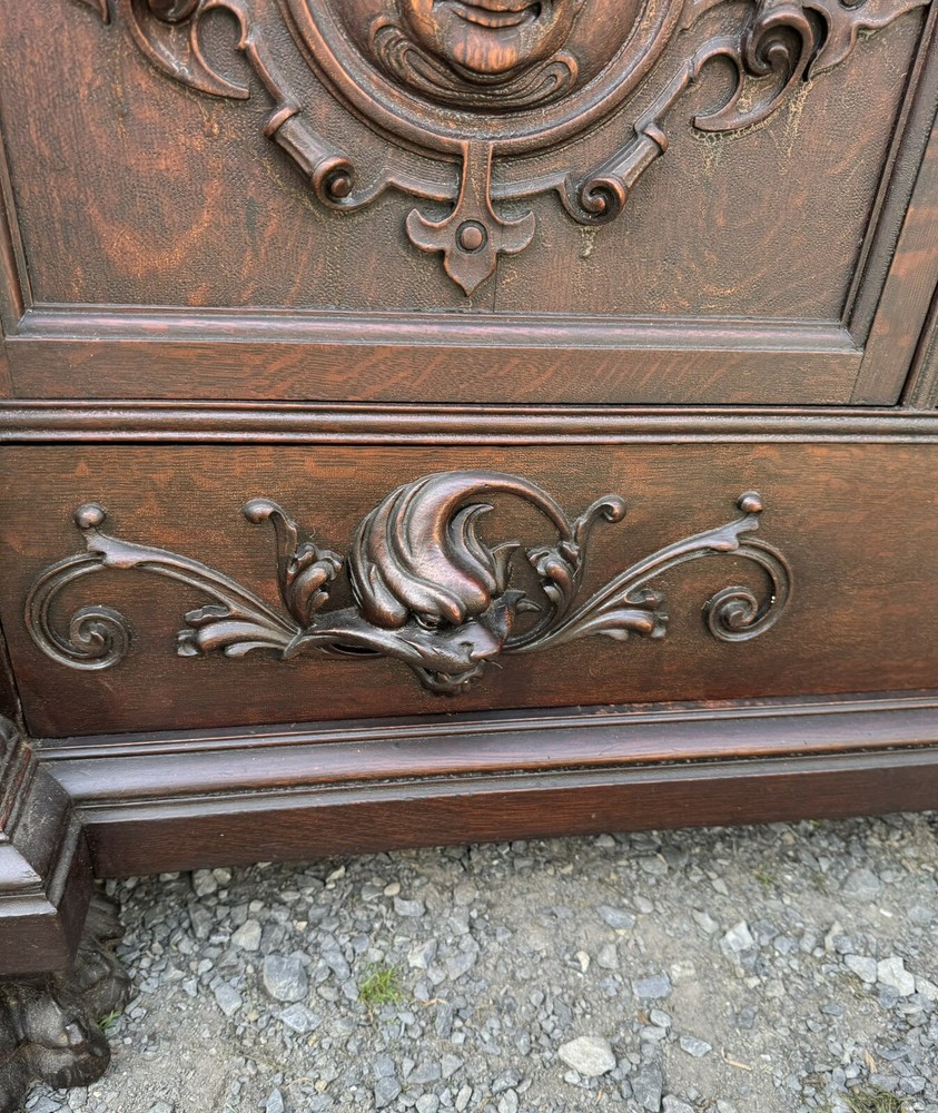 A. J. JOHNSON CARVED FIGURAL OAK SIDEBOARD