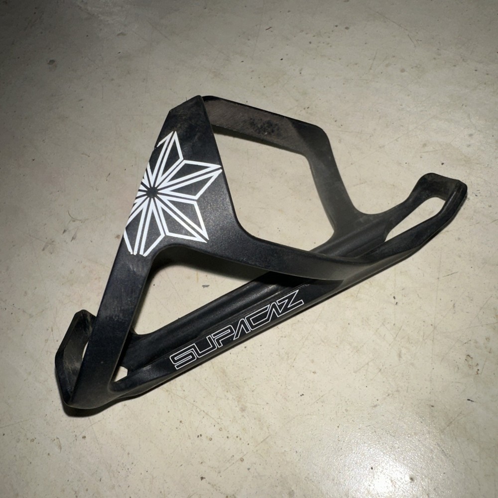 Supacaz Tron Poly Bottle Cage Black Side Loader Right Hand Load White Graphic