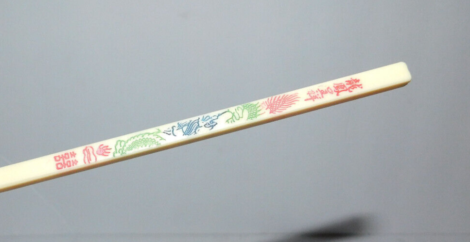 NEAT PAIR OF USED PLASTIC CHOPSTICKS