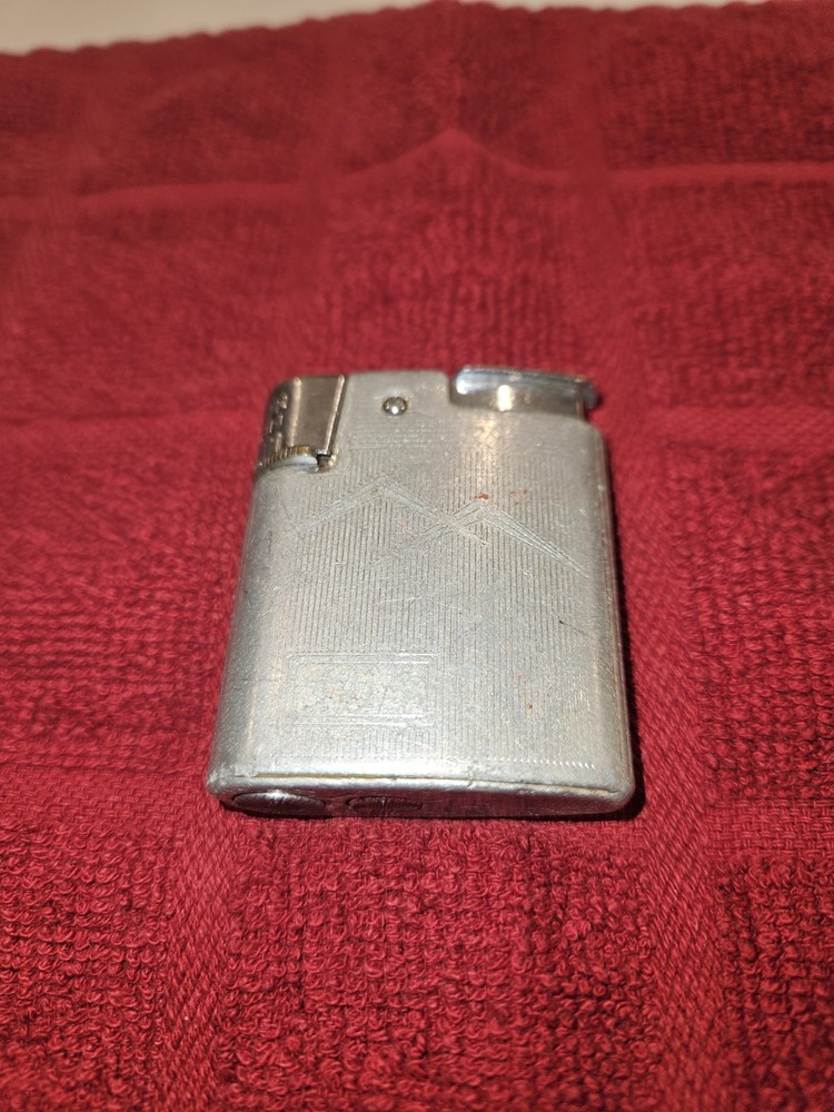 7 sitesVintage Ronson Standard or Adonis pocket lighter.