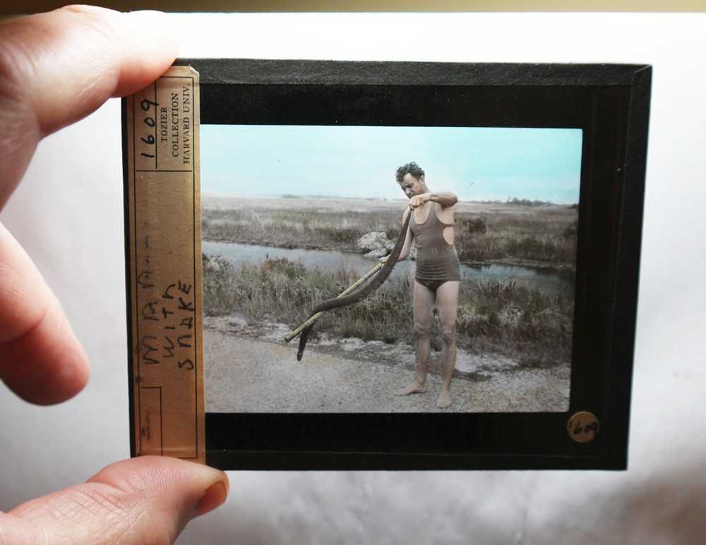 Man with "BIG SNAKE" GLASS SLIDE