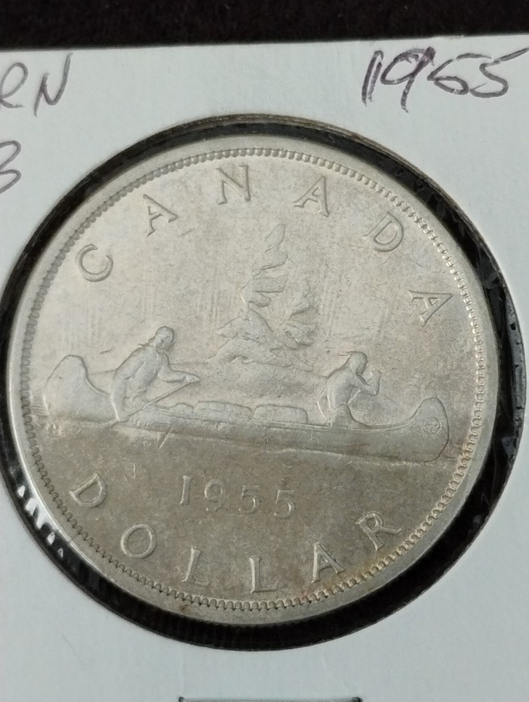 1955 Canada 1 dollar. Arn with die break