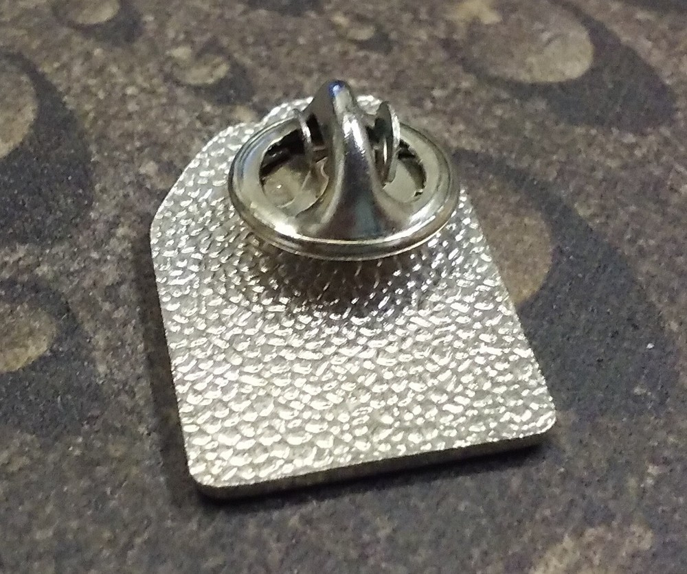 Every Species Counts pin badge