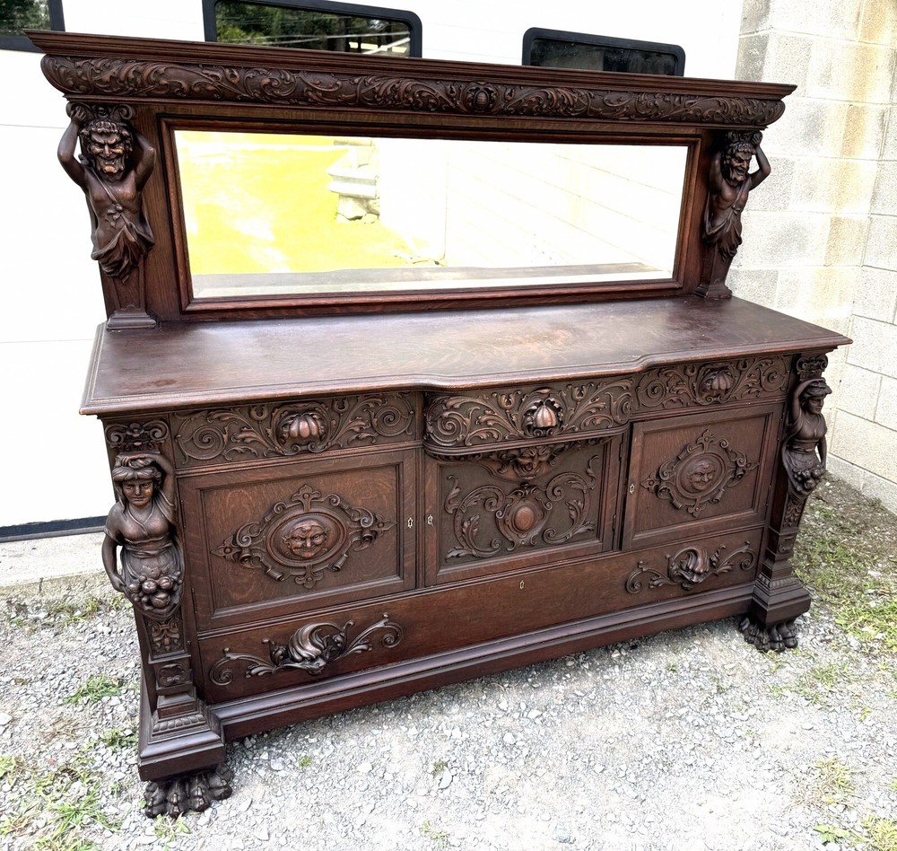 A. J. JOHNSON CARVED FIGURAL OAK SIDEBOARD