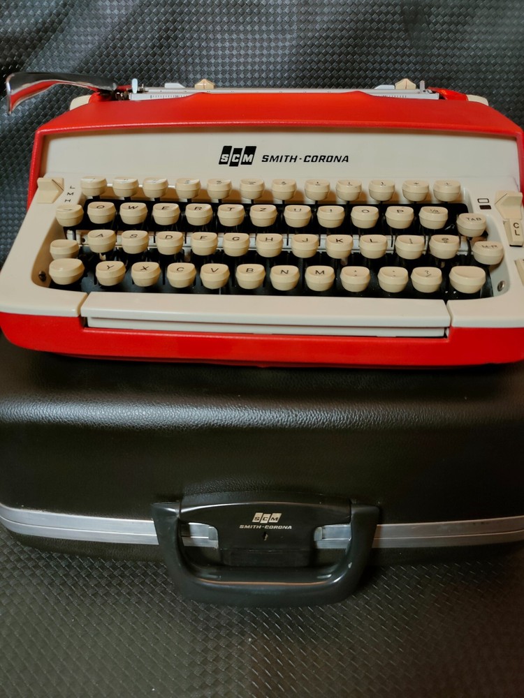 red, portable Smith Corona Galaxie typewriter with Cursive / Handwritten Script