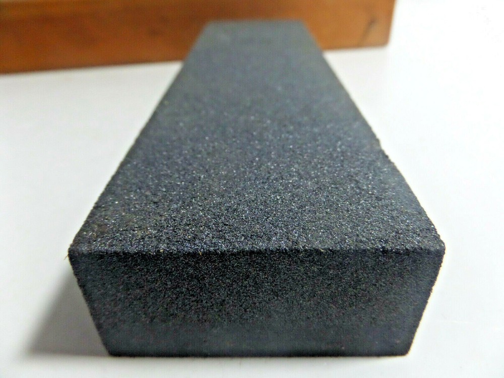 sharpening stone mounted on wood base