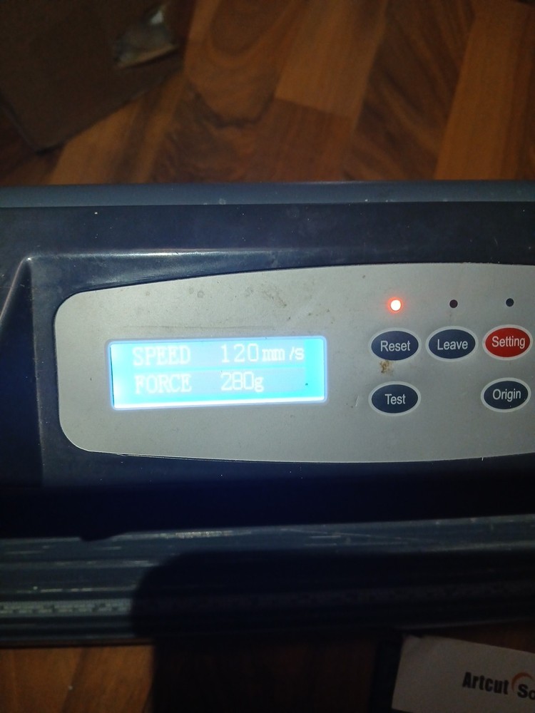 computer-controlled vinyl cutter machine Some Vinyl Material And Two Discs