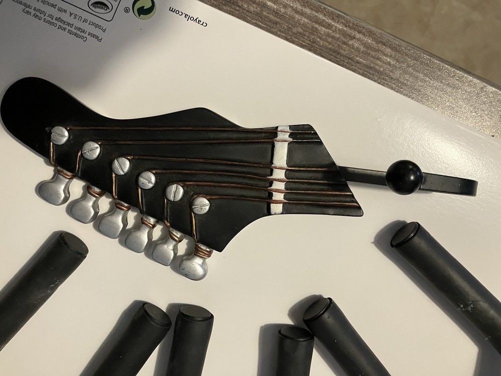 Three guitar wall hangers plus guitar hook