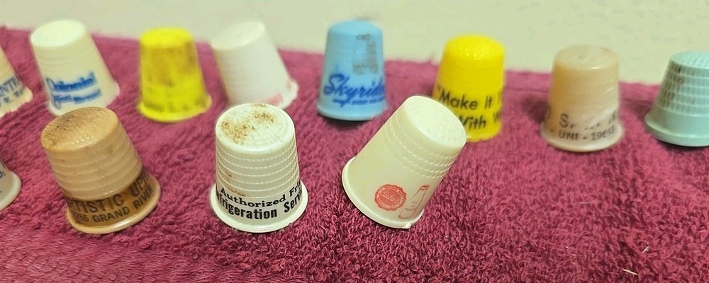 17 Plastic Thimbles 15 Have Advertising On Them
