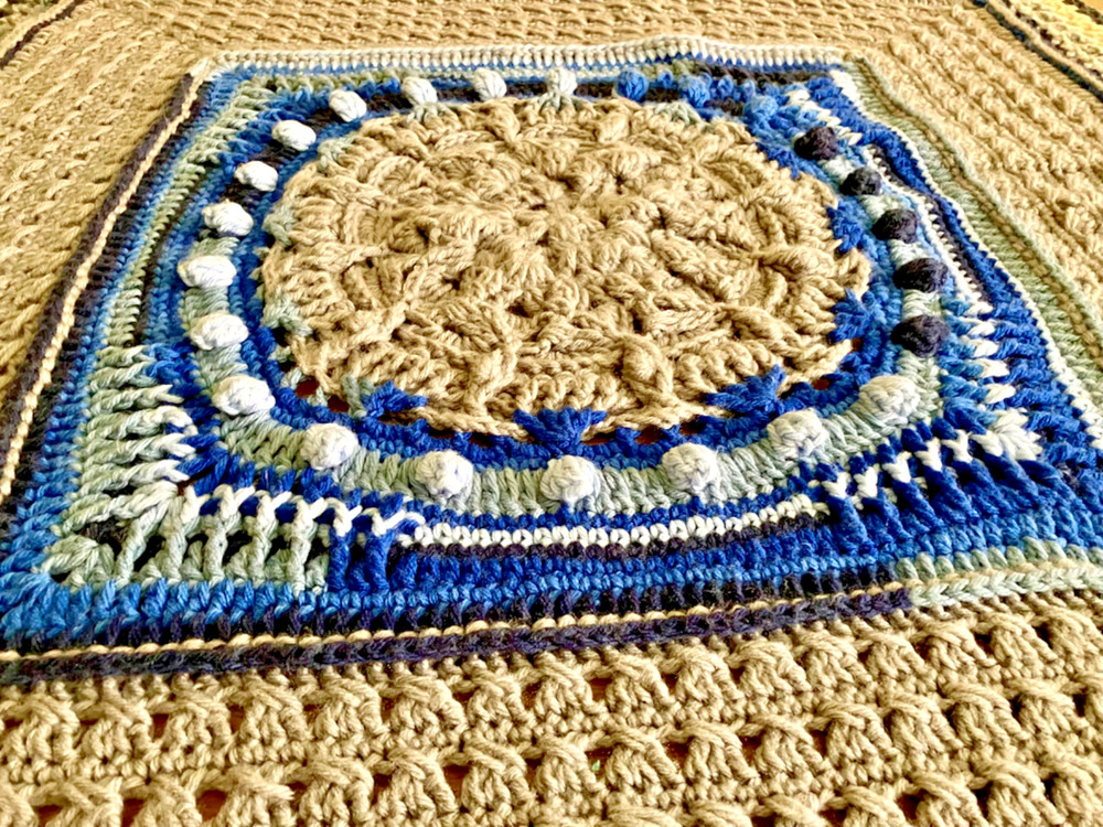 handmade, textured crocheted afghan