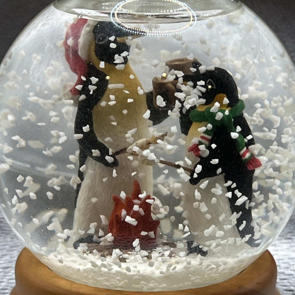 Eddie Bauer Penguin Snow globe 2002 Open Fire Roasting Marshmallows