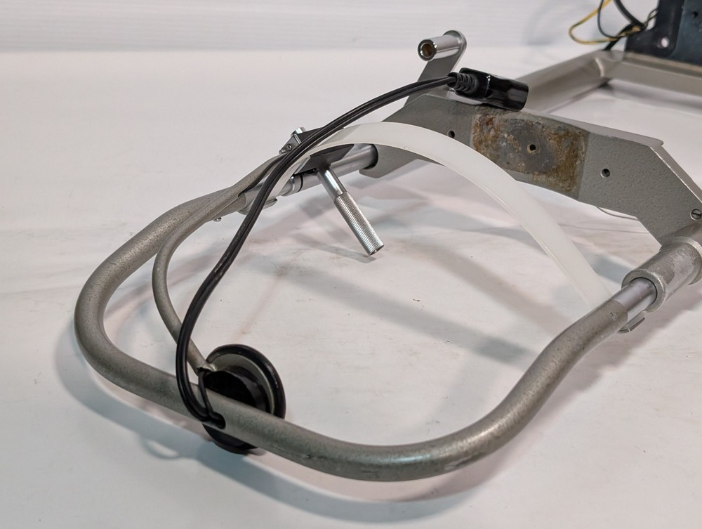 Optometry patient eye exam chin head rest and forehead bracket mount assembly